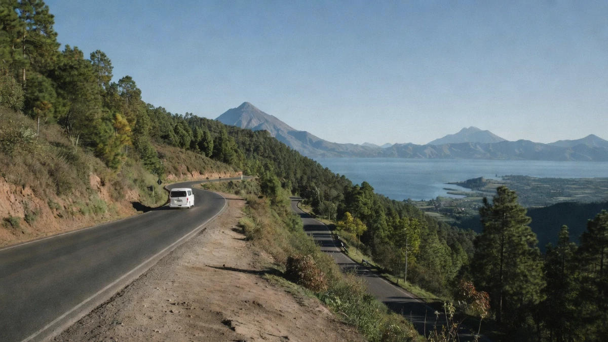 Winding highland road through pine forest on the route from Antigua to Lake Atitlán boat tours